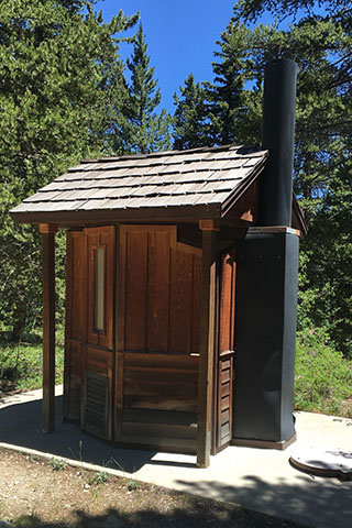 campground privy with wooden facade