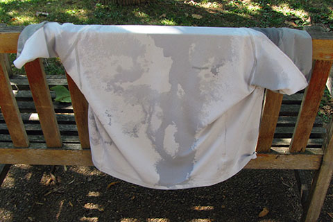 sweaty shirt hanging on a bench