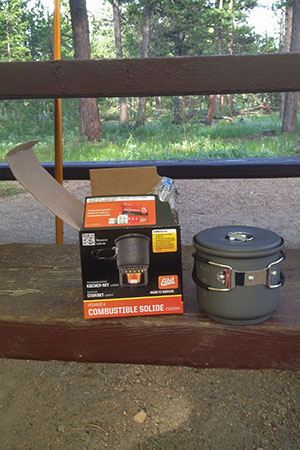 Stove kit and box on a picnic table