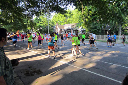 Runners passing