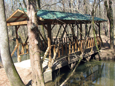 covered bridge on the trail to the public boat launch