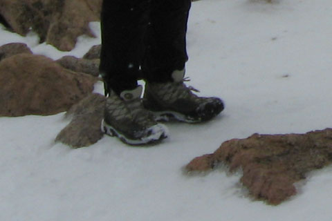 Boots in the snow on Mount Bierstadt