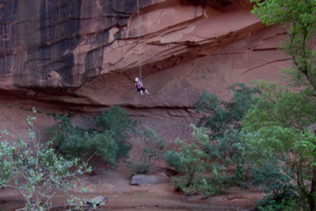rappelling from the canyon wall 